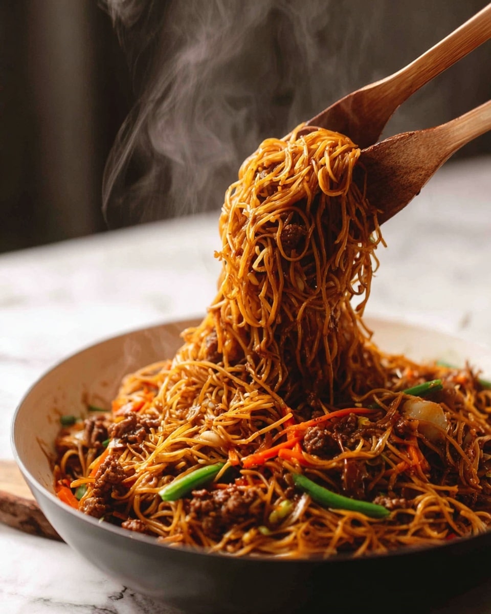 The image shows a large white bowl filled with long, thin, brown noodles mixed with small pieces of cooked meat and vegetables like orange carrot strips and green beans. Two wooden spatulas lift a portion of the noodles, which look soft and tangled, with the meat and vegetables evenly spread throughout. The bowl sits on a white marbled surface, and the background is blurred, giving focus to the steaming, rich-colored noodles being lifted. photo taken with an iphone --ar 4:5 --v 7