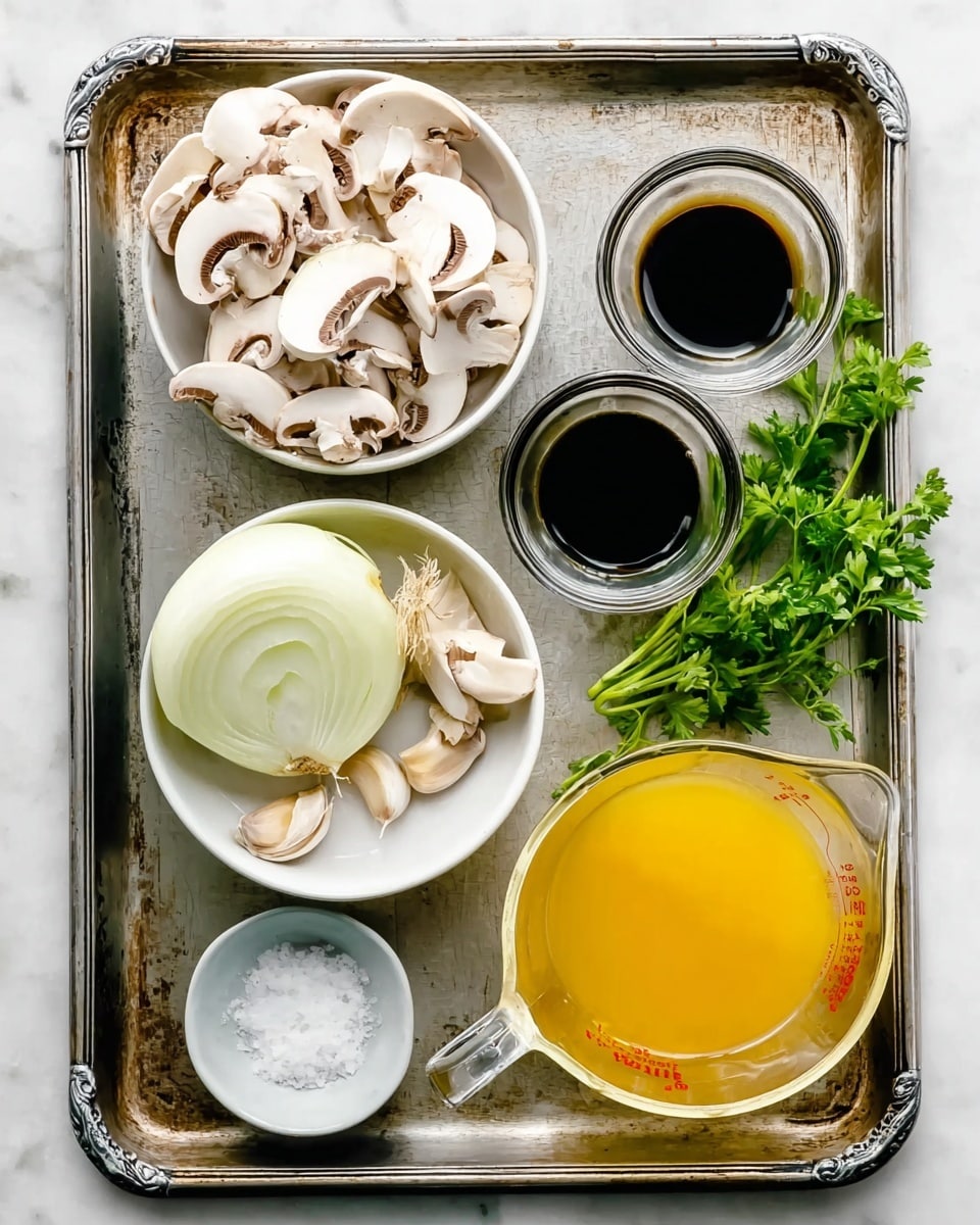A metal tray with a shiny, slightly worn surface holds a variety of fresh ingredients arranged neatly. Two white bowls filled with sliced white mushrooms are positioned on the left side of the tray, one near the top and the other near the bottom. At the top right, there are two small clear glass cups, one filled with dark soy sauce and the other with light oil. In the center, there is a halved onion showing its white layers and papery golden skin, next to two small whole garlic cloves. At the bottom right, a clear glass measuring cup is filled with a bright yellow broth. Fresh green parsley sprigs and a small white bowl with white salt sit together near the bottom left of the tray. The tray rests on a white marbled surface. photo taken with an iphone --ar 4:5 --v 7