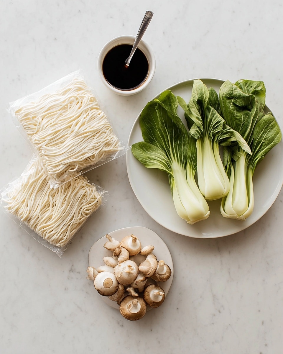 The image shows three vacuum-sealed blocks of pale, thick white noodles placed in the bottom left, with a white bowl on the top left holding dark soy sauce and a small metal fork resting inside. To the right, a white plate has three fresh, light green bok choy arranged with their leafy ends fanning out and four light brown mushrooms clustered next to them. All items are set on a white marbled surface, creating a clean, simple composition. photo taken with an iphone --ar 4:5 --v 7
