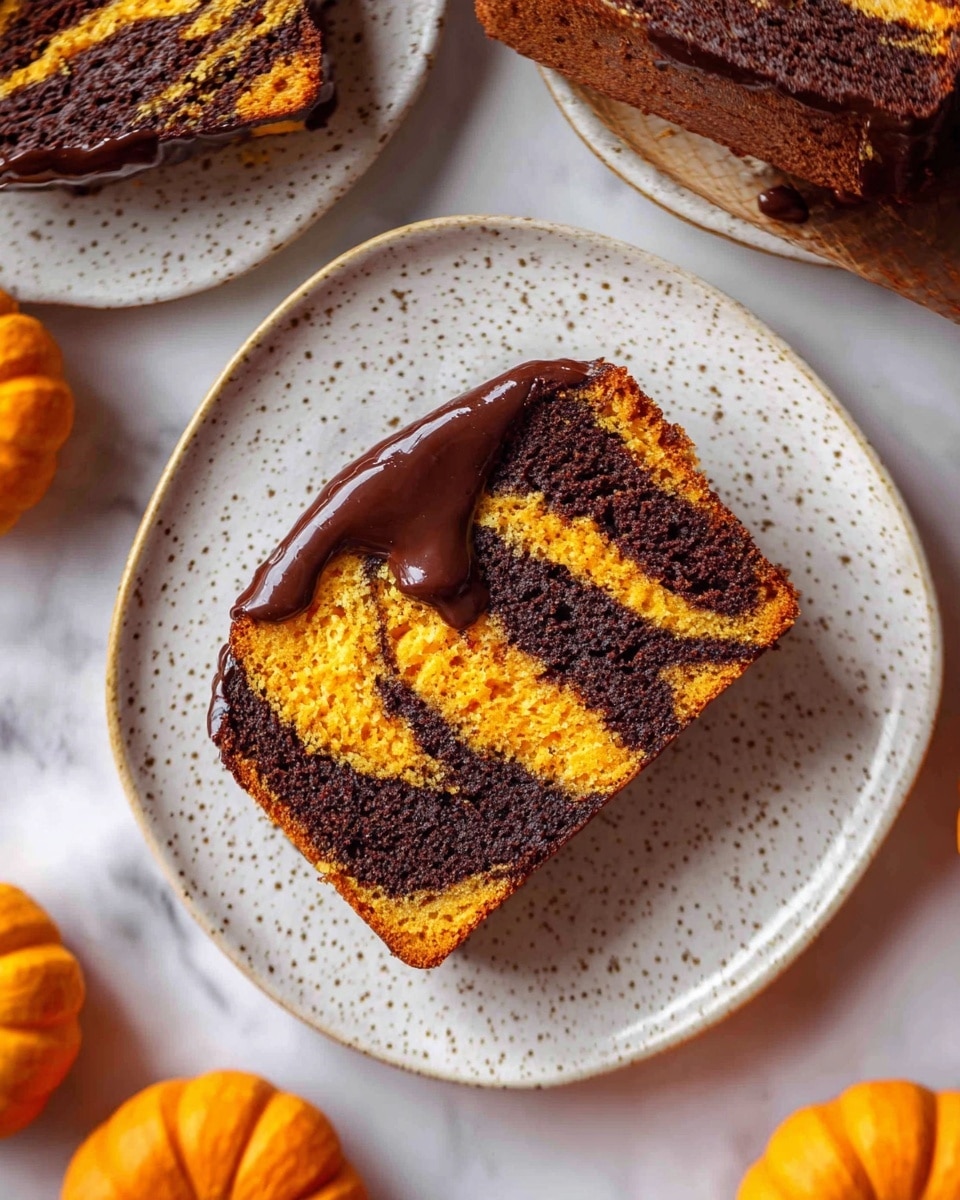 A single slice of two-layered cake rests on a white speckled plate with a round shape and subtle ridged patterns. The cake has alternating thick layers of dark brown and bright orange, swirling together in a marbled pattern. The top edge of the slice is coated with a shiny dark chocolate glaze that drips slightly down one side. Surrounding the plate are other pieces of the same cake and part of the whole cake with similar striped layers and shiny chocolate on top. The scene is set on a white marbled surface with small orange pumpkins visible nearby. Photo taken with an iphone --ar 4:5 --v 7