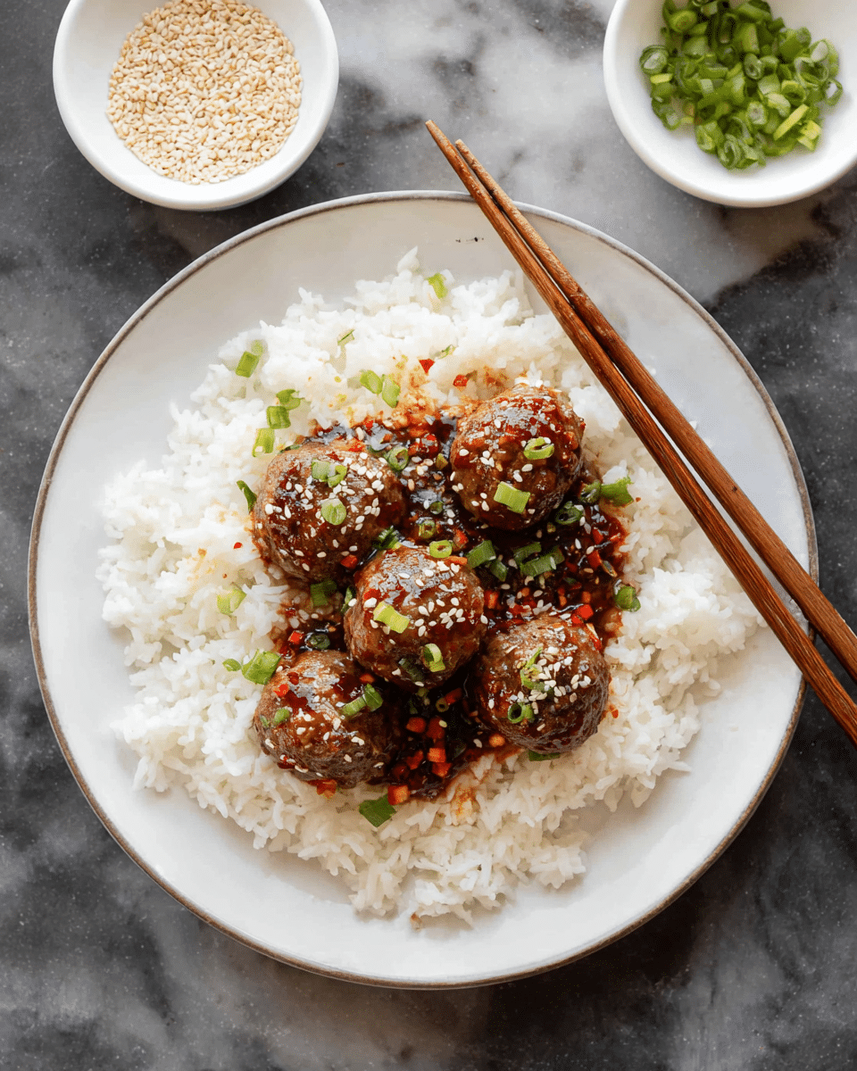 A white plate with a base layer of fluffy white rice spread evenly. On top, there are five small round meatballs coated with a shiny dark brown sauce that has red chili flakes in it. The meatballs are sprinkled with white sesame seeds and chopped green onions, adding texture and color. Two wooden chopsticks are placed diagonally on the edge of the plate. Above the plate, there are two small white bowls, one filled with sesame seeds and the other with chopped green onions. The whole setting is on a white marbled surface. photo taken with an iphone --ar 4:5 --v 7