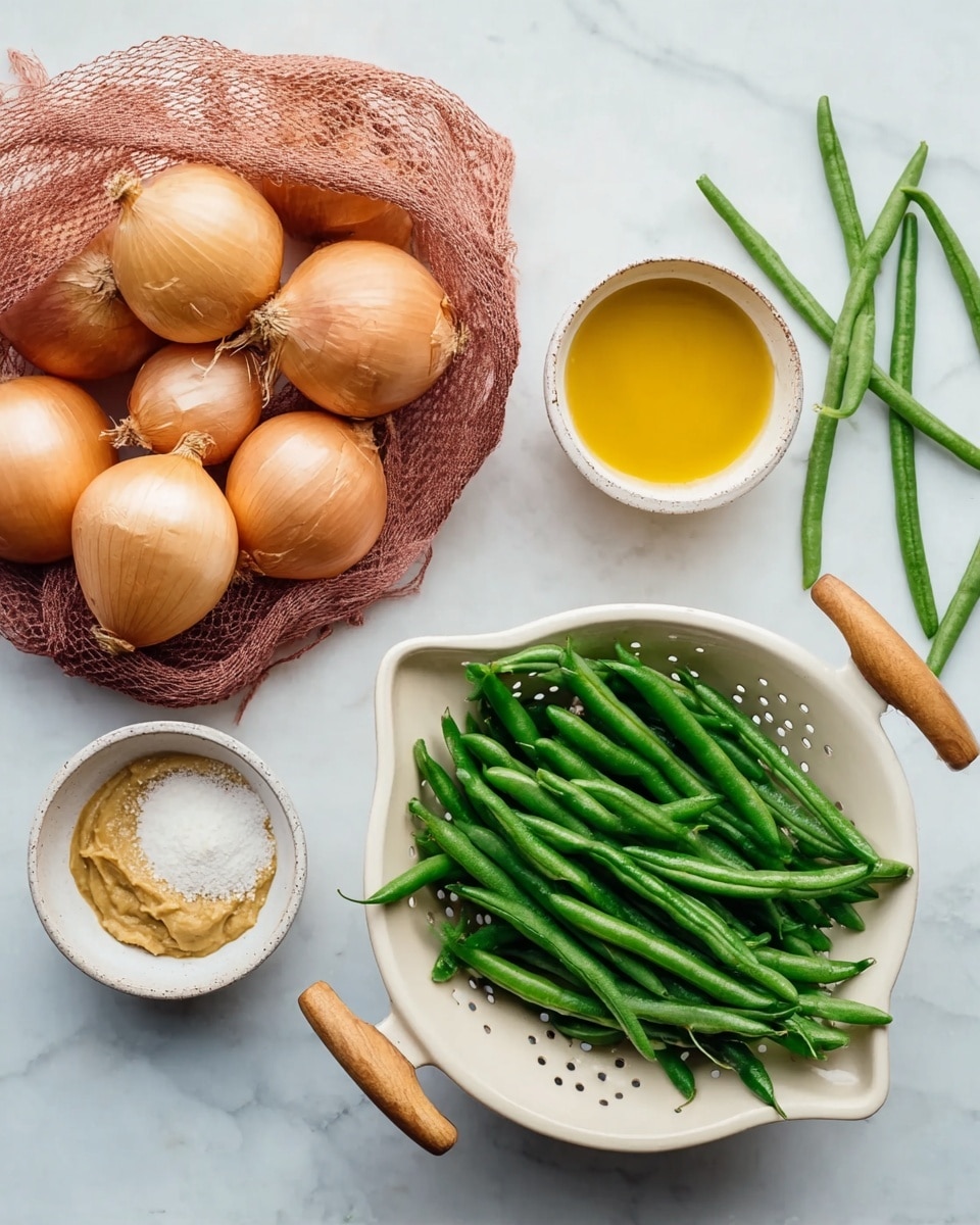 The image shows a group of fresh ingredients on a white marbled surface. On the left side, there is a red net bag full of brown onions with smooth skins. Near the center are three small white bowls: the top bowl has a light brown paste, the middle bowl holds melted yellow butter, and the bottom bowl contains a fine white powder. On the right side, a white colander with wooden handles is full of bright green string beans spilling out slightly, with two string beans lying loose nearby. The arrangement is simple and tidy, and the natural colors stand out against the white marbled background photo taken with an iphone --ar 4:5 --v 7