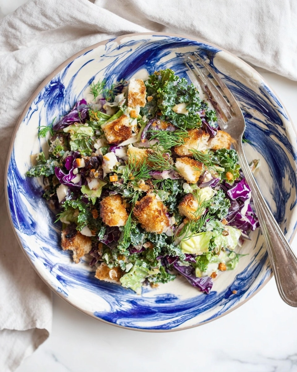 A white plate with blue and white swirls holds a mixed salad. The salad has chopped green kale, light green lettuce, purple cabbage, small white cheese cubes, and crispy golden brown bread pieces. It is sprinkled with some herbs in green and dark orange tones, with small fine green dill sprigs around the plate's edges. A fork is placed on the right side on the plate. The scene is set on a white marbled surface with a white cloth nearby. Photo taken with an iphone --ar 4:5 --v 7