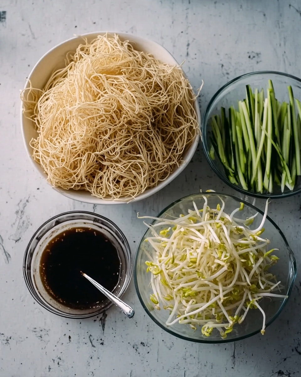 The image shows four bowls arranged on a white marbled surface. The largest bowl is white and filled with a large pile of light beige crispy noodles, creating a tangled texture. Next to it, a smaller glass bowl is filled with long, thin, dark green strips of cucumber. Above it, another glass bowl contains a heap of pale yellow bean sprouts with small green shoots. Below these two, a clear glass bowl holds a dark brown sauce with a spoon inside. A woman's hand is reaching from the left side of the image, touching the edge of the cucumber bowl. Photo taken with an iphone --ar 4:5 --v 7