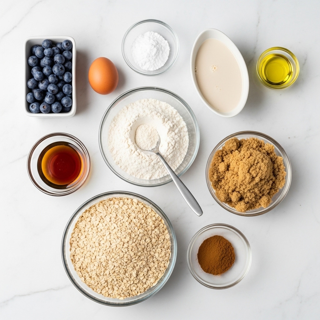 The image shows an arrangement of ten clear or white bowls and one brown egg on a white marbled surface. At the top left is a small rectangular white bowl filled with dark blue blueberries. Below it is a single brown egg placed loose on the surface. To the right of the egg is a small round clear bowl with white baking powder. Next to the baking powder is an oval white bowl holding a creamy, light beige almond milk. Below the milk is a round clear bowl filled with light brown, crumbly brown sugar. To the left of the brown sugar is a clear bowl holding a dark amber maple syrup. In the center is a bowl filled with white flour and a grey spoon resting inside. Below the flour is a large round clear bowl with light beige oats. To the right of the oats is a small clear bowl with ground cinnamon, showing its warm reddish-brown color. Above the cinnamon is a small clear cup holding light yellow oil. Each ingredient is clearly visible and spaced neatly on the white marbled surface photo taken with an iphone --ar 4:5 --v 7