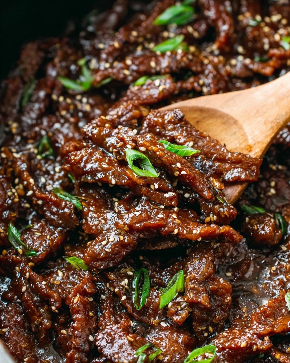 This close-up image shows many thin, dark brown strips of meat coated in a thick, shiny sauce with a rich, glazed texture. Small white sesame seeds and black sesame seeds are sprinkled across the top, adding contrast. Bright green slices of fresh scallions are scattered evenly, giving a fresh pop of color. A wooden spoon is partially submerged in the dish, lifting some of the saucy meat. The background is a white marbled texture. photo taken with an iphone --ar 4:5 --v 7