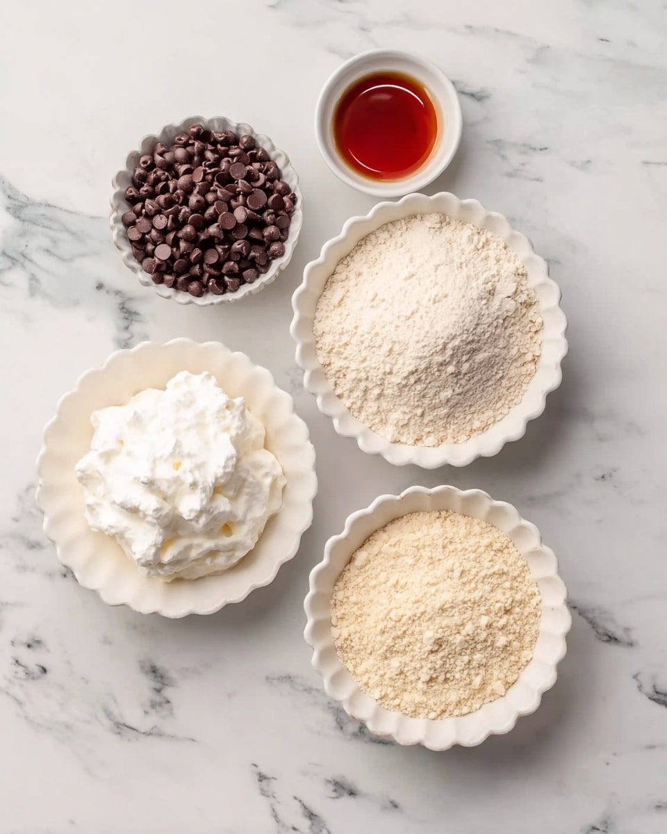 The image shows five dishes arranged on a white marbled surface. Starting from the top left, there is a small bowl filled with dark brown chocolate chips. To the right of it, a small cup holds a reddish-brown liquid, likely syrup or oil. Below these, a larger white bowl contains light beige flour with a smooth texture. To its left, there is a white scalloped bowl filled with fluffy white whipped cream. Finally, in the bottom right corner, another white scalloped bowl is filled with fine almond flour, showcasing a slightly grainy texture. Photo taken with an iphone --ar 4:5 --v 7