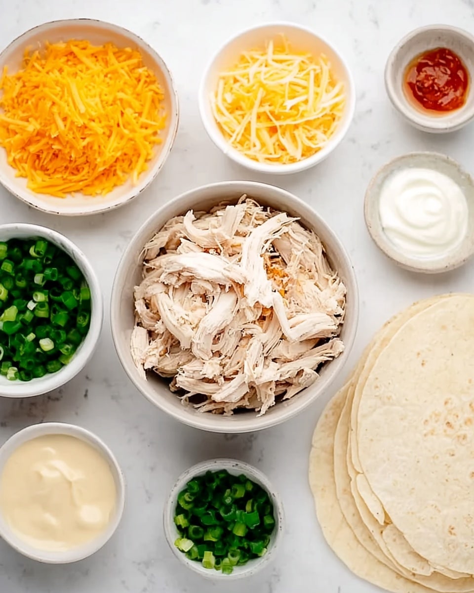 The image shows a white marbled surface with a collection of small white bowls and tortillas arranged neatly. At the center, there is a bowl filled with shredded cooked chicken, light beige in color with some brown edges. Surrounding it are smaller bowls: one with bright orange shredded cheddar cheese, one with finely chopped green onions, one with light yellow shredded cheese, one with white sour cream, one with a creamy pale sauce, one with a small amount of reddish sauce, and one with a light beige grated ingredient. On the right side are stacked soft white tortillas. The overall layout presents a tidy and colorful preparation for making wraps or tacos. photo taken with an iphone --ar 4:5 --v 7