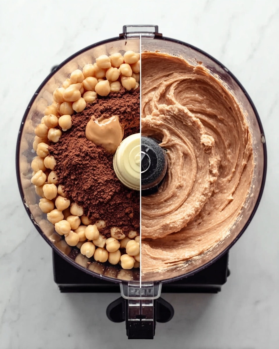 The image shows two top-down views of a food processor on a white marbled surface. On the left side, the food processor bowl is filled with light beige chickpeas, a dollop of light brown peanut butter, and a heap of dark brown cocoa powder, arranged in separate sections on top of the chickpeas. On the right side, the food processor bowl reveals a smooth, light to medium brown creamy mixture with a slightly swirled texture made from the ingredients blended together. The food processor base is black with a control switch visible, and the transparent bowl is clear, showing the contents inside. Photo taken with an iphone --ar 4:5 --v 7