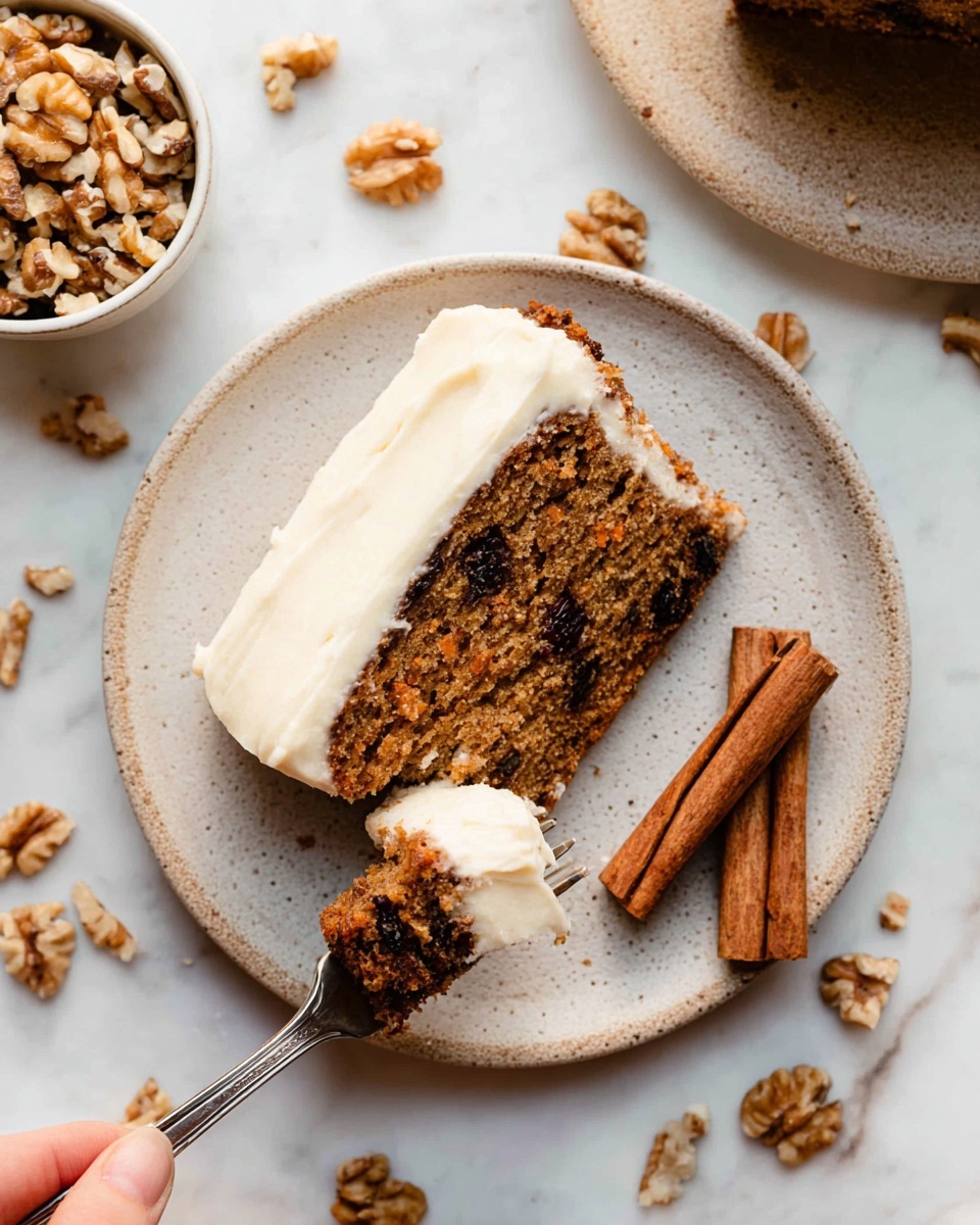 A 1-layer slice of brown carrot cake with visible bits of nuts and dark raisins sits on a white plate, topped with a smooth white frosting layer covering the top edge. A woman's hand holds a metal fork with a small piece of the cake covered in thick white frosting, resting on the left side of the plate. Next to the cake slice on the right side are three cinnamon sticks. The background is a white marbled surface scattered with walnut pieces, and a small white bowl filled with chopped walnuts is partially visible in the top left corner. Photo taken with an iphone --ar 4:5 --v 7