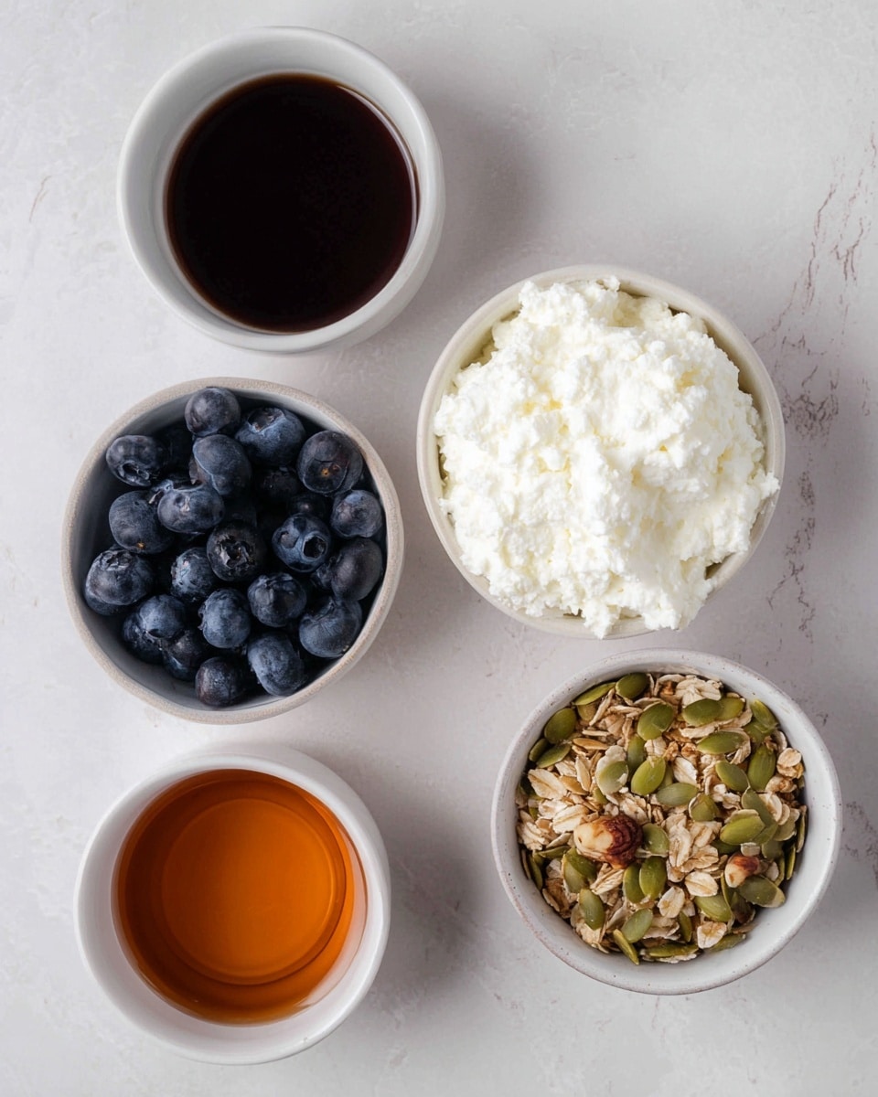 The image shows four small white bowls placed on a white marbled surface. The top right bowl holds a thick layer of white cottage cheese with a soft and slightly lumpy texture. The top left bowl is filled with plump, dark blue blueberries, showing a shiny and smooth surface. The bottom right bowl contains a mix of granola with oats, green pumpkin seeds, and pieces of nuts, giving a crunchy and textured look. The bottom left bowl is filled with a dark amber liquid, likely syrup, with a smooth and shiny surface. photo taken with an iphone --ar 4:5 --v 7