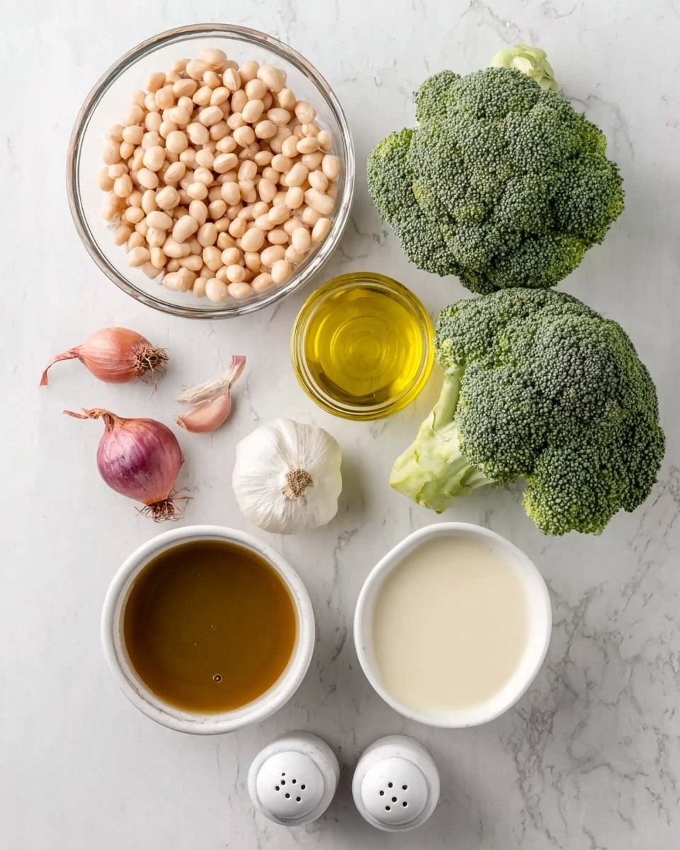 The image shows fresh ingredients arranged on a white marbled surface. At the top right are two green broccoli heads with detailed textures. Below them to the left is a clear glass bowl filled with small, pale beige beans. Nearby are two small shallots with purplish skin and one whole white garlic bulb. To the right of the garlic is a small round white plate holding light golden olive oil. Below these items is a larger white bowl filled with creamy white liquid. At the bottom left corner is a bigger white bowl holding rich brown broth. Two white salt and pepper shakers are placed between the bowls. Photo taken with an iphone --ar 4:5 --v 7