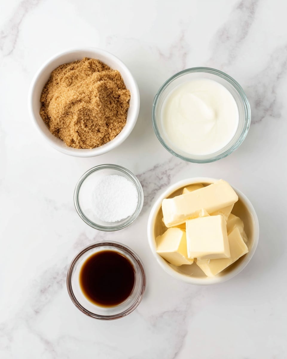 The image shows five small white bowls and glass containers placed on a white marbled surface. The top left white bowl is filled with light brown soft packed sugar with a crumbly texture. To its right, a small glass container holds white cream with a smooth surface. Below, a clear glass bowl contains a small amount of white salt crystals. To the left of this bowl, a small glass bowl has dark brown vanilla extract with a shiny liquid surface. Lastly, the bottom right white bowl contains several square pieces of pale yellow butter with smooth edges stacked loosely. photo taken with an iphone --ar 4:5 --v 7