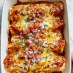 Creamy Chicken Enchiladas with Red Sauce and Fresh Toppings Recipe