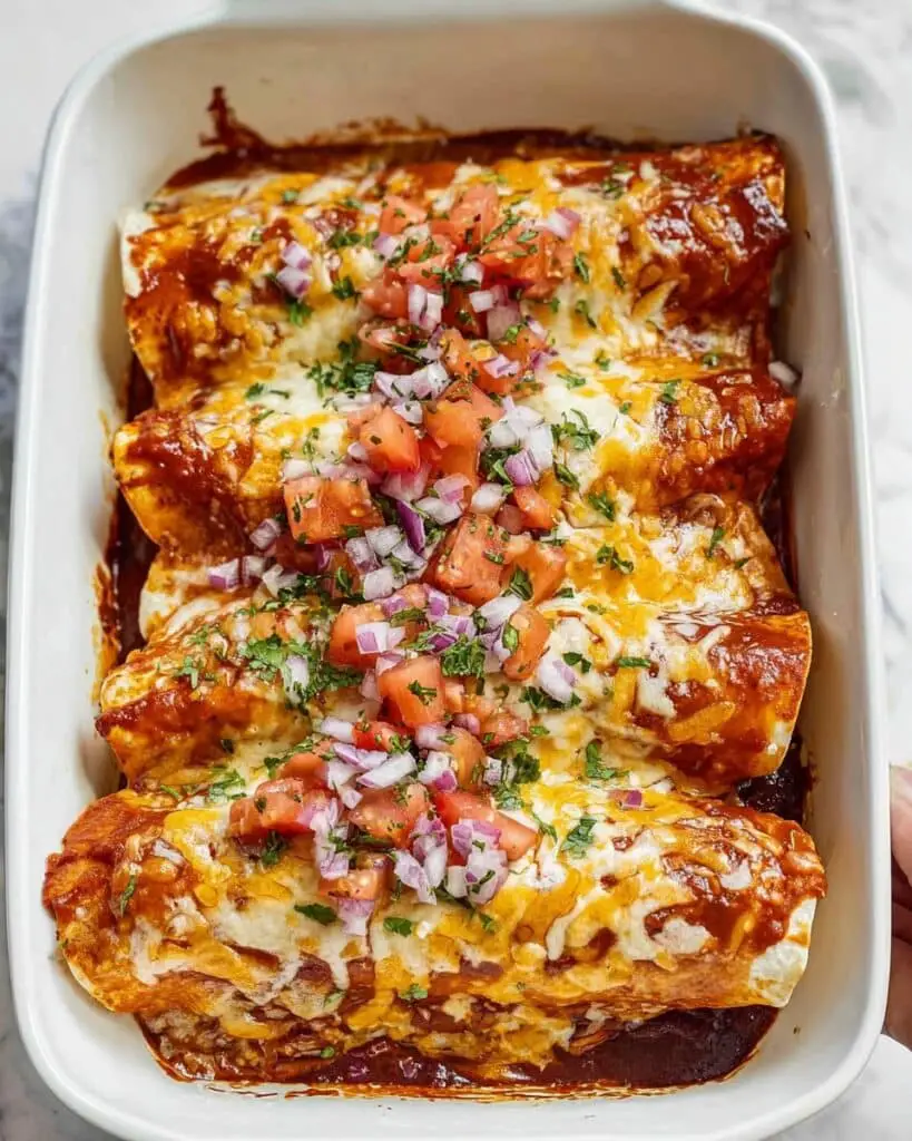 Creamy Chicken Enchiladas with Red Sauce and Fresh Toppings Recipe
