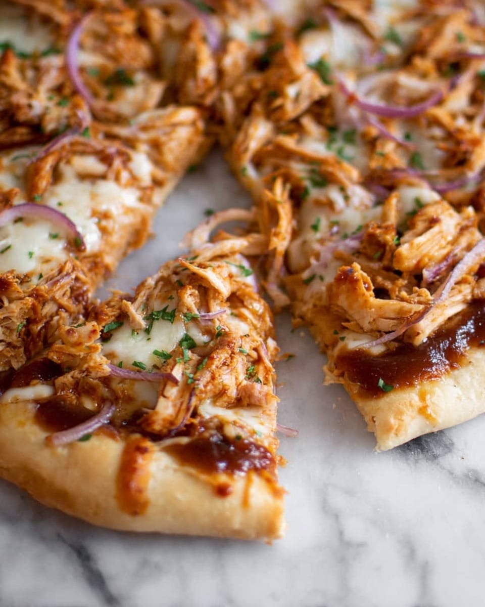 The image shows a close-up of a pizza sliced into pieces on a white marbled surface. The pizza has a thick crust that is light golden and fluffy. The first layer is a shiny, dark brown sauce spread evenly under the toppings. On top, there is shredded light brown chicken mixed with thin slices of purple-red onion. The next layer is melted cheese with a pale creamy color, visible between the chicken and onions. Sprinkled green herbs add small bright green spots on top. The focus is on one slice being slightly pulled away, showing texture and layers clearly. photo taken with an iphone --ar 4:5 --v 7