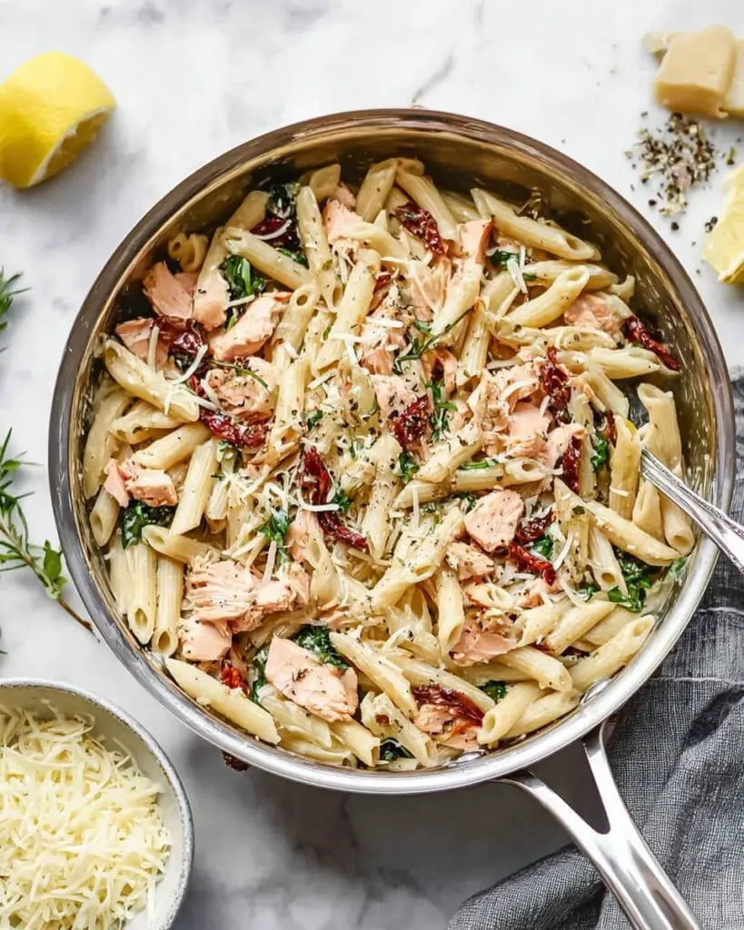 Lemon Herb Salmon Pasta with Sun-Dried Tomatoes and Basil Recipe
