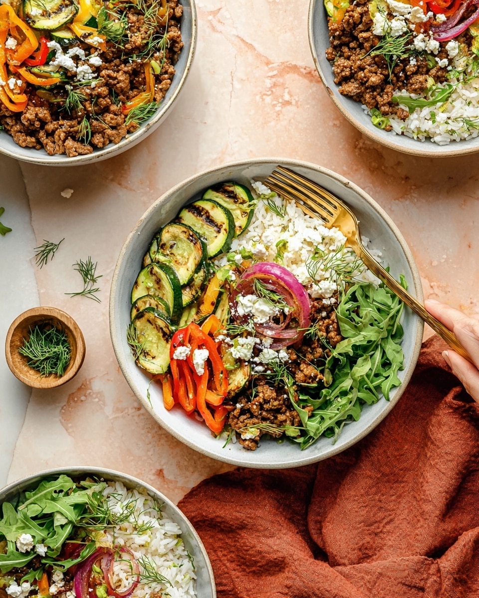 The image shows three bowls filled with a colorful layered dish. Each bowl has a base layer of white rice, topped with cooked ground meat that is brown and crumbly. On top of the meat, there are slices of grilled zucchini with green skin and light grill marks, red and orange bell pepper strips, and thin slices of red onion. Fresh green leafy arugula forms the bottom layer in the closest bowl, adding bright green color. The dish is sprinkled with small white cheese crumbles and fresh green dill sprigs scattered on top. Golden forks rest in two bowls, with one fork held by a woman’s hand. The bowls are white and set on a white marbled surface with a rust-colored cloth nearby. The overall look is vibrant and fresh with a mix of textures from soft rice, tender vegetables, and crumbly meat and cheese. Photo taken with an iphone --ar 4:5 --v 7