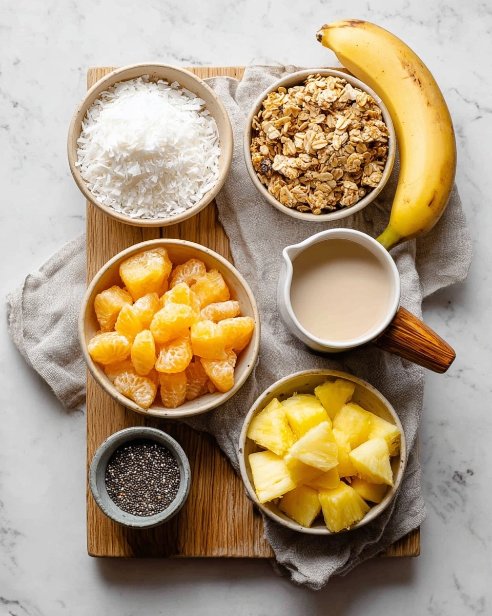 A top view of a wooden board on a white marbled surface with six small bowls and one whole banana arranged neatly. The top left bowl shows white shredded coconut, the top right bowl contains light brown granola clusters with visible seeds. Below the shredded coconut is a beige bowl filled with medium-sized orange frozen fruit pieces. To the right of the orange fruit, a banana lies partly on a light gray cloth. Next to the banana, a white cup with a wooden handle holds a light beige creamy liquid. At the bottom left, a small gray bowl contains tiny black chia seeds. The bottom right beige bowl is filled with yellow frozen pineapple chunks. Photo taken with an iphone --ar 4:5 --v 7