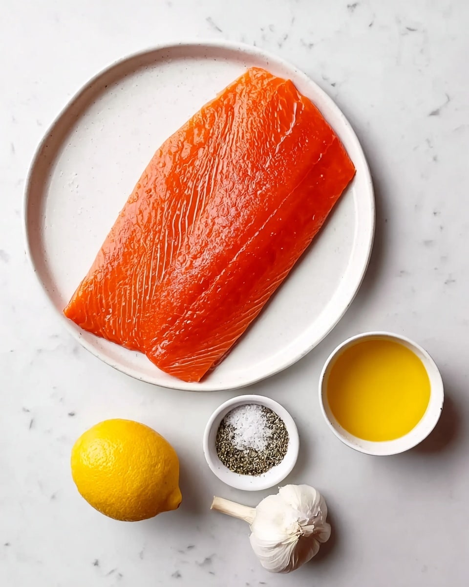 A single large, bright orange salmon fillet lies flat in the center of a white round plate, showing its smooth and slightly shiny texture. Below the plate on a white marbled surface, there is a small white bowl filled with melted yellow butter on the right, a whole white garlic bulb next to the bowl, a whole yellow lemon at the bottom left, and a small round white dish containing coarse white salt and black pepper on the left side. The arrangement is clean and simple. photo taken with an iphone --ar 4:5 --v 7