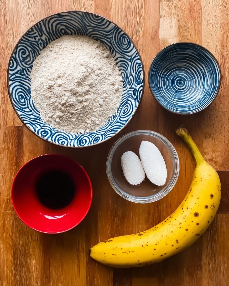 The image shows five ingredients arranged on a wooden surface: a large bowl filled with light brown flour at the top, a small blue bowl with white spiral patterns on the left, a small clear bowl with two white scoops of a powdery substance to the right of the blue bowl, a small red bowl filled with a dark liquid below the blue bowl, and a ripe yellow banana with small brown spots on the right side, curved slightly toward the bowls. The background is white marbled texture. photo taken with an iphone --ar 4:5 --v 7